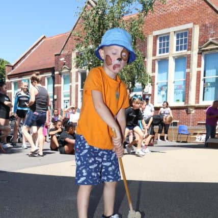 Joshua Brown, four, has a go at putting