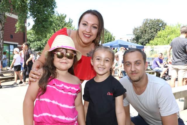 Ellice Humphrey, Jesse Steele, five, Elsie Wilson, five, and Jack Wilson enjoying the sun at the summer fair