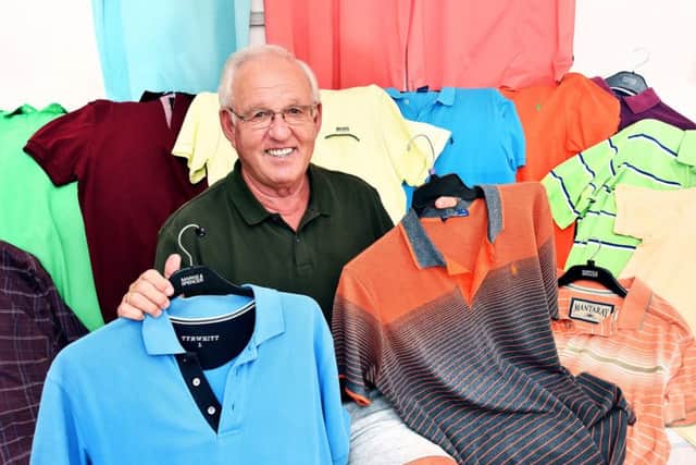 Malcolm with an assortment of his polo shirts. Photo: Paul McCabe/ UNP 0845 600 7737