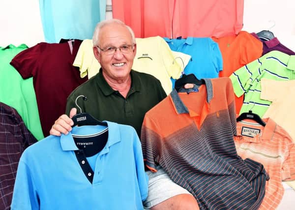 Malcolm with an assortment of his polo shirts. Photo: Paul McCabe/ UNP 0845 600 7737