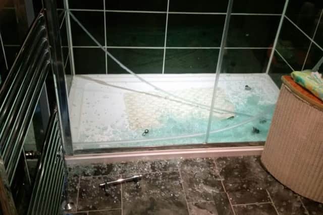 The shattered shower door    Picture: Richard Newman