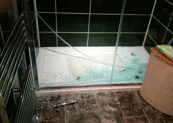 The shattered shower door    Picture: Richard Newman