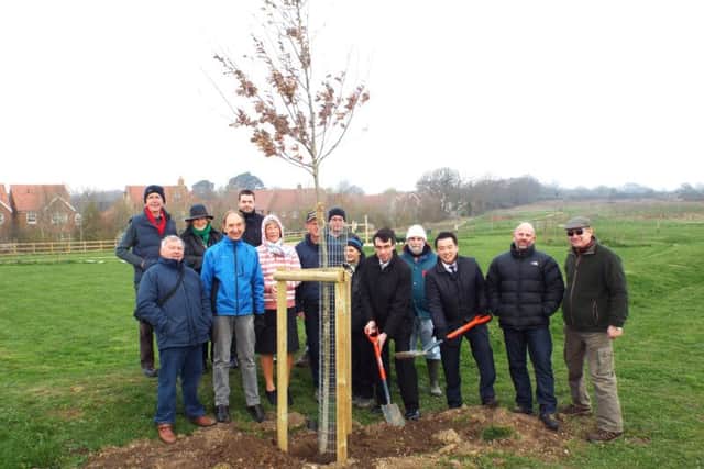 MP Alan Mak with volunteers from the Friends of Hampshire Farm Meadow
