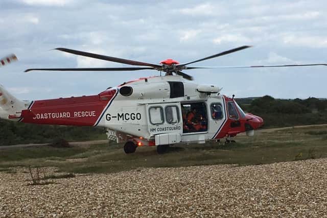 The search and rescue helicopter involved in rescuing five people at Stokes Bay. Picture: Hill Head Coastguard