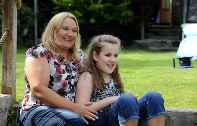 Scarlett Winter, 11, with her mum Stacy Winter, 43, from Farlington. 
PPicture by:  Malcolm Wells (170714-4011)