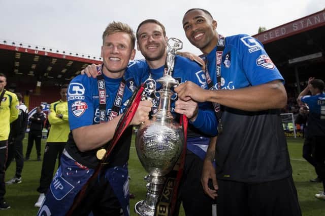 Brett Pitman celebrates Bournemouth's Championship title in 2012-13 with Callum Wilson and Gosport's Matt Ritchie, left