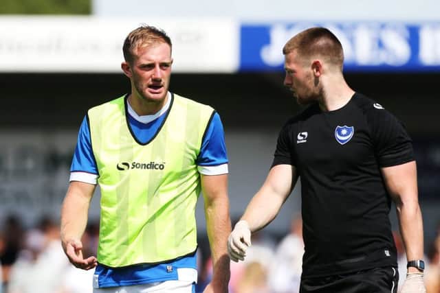 Matt Clarke injured against the Hawks. Picture: Joe Pepler