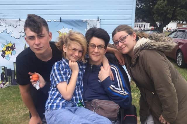 Ben Jackson, centre left, sitting with his mum Lisa, brother Sam and sister Christina