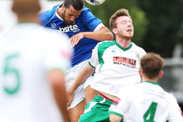 Christian Burgess in action for Pompey against Bognor at Nyewood Lane