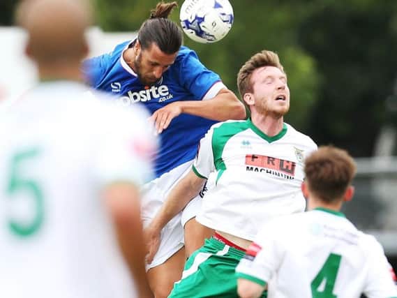Christian Burgess in action for Pompey against Bognor at Nyewood Lane