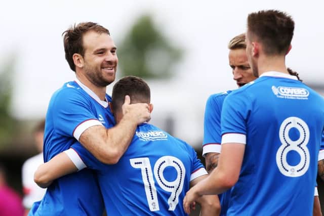 Brett Pitman and Conor Chaplin, 19, celebrate a goal at Bognor. Picture: Joe Pepler