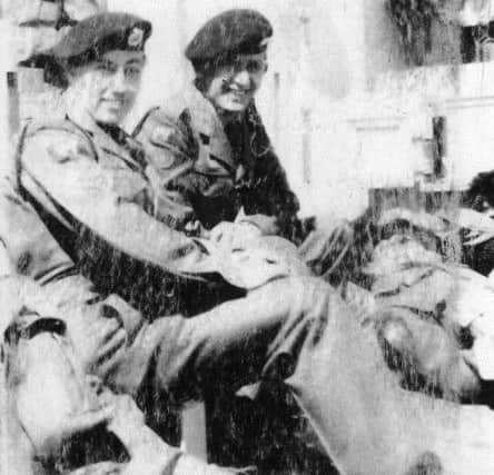 Lance-Corporal Philip Mason, left, and J Manning, on board a frigate heading for the Channel Islands. Both were tradesmen so were allowed to disembark first.