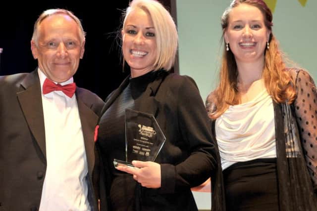 Steph Smith, left, and Caitlin Earey, from Rock Up, winners of Leisure Venue of the Year 2016, with Colin Wilding from Gunwharf Quays