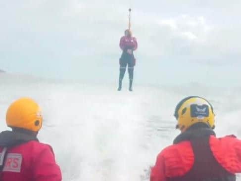 The crewman is winched towards the GAFIRS lifeboat
