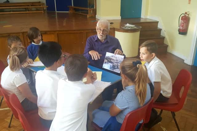 Brian Mitchell explains to the children what life was like for him during wartime