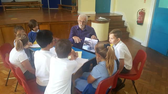 Brian Mitchell explains to the children what life was like for him during wartime
