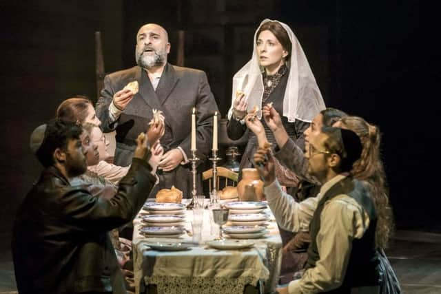 Omid Djalili as Tevye and Tracy-Ann Oberman as Golde in Chichester Theatre's production of Fiddler on the Roof. 
Photo by Johan Persson
