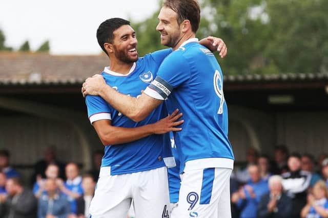 Danny Rose, left, congratulates summer recruit Brett Pitman following his second goal in Pompeys 2-0 win at Bognor on Saturday