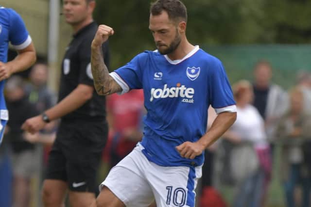Milan Lalkovic celebrates his goal in Pompey's 8-0 win Picture: Neil Marshall