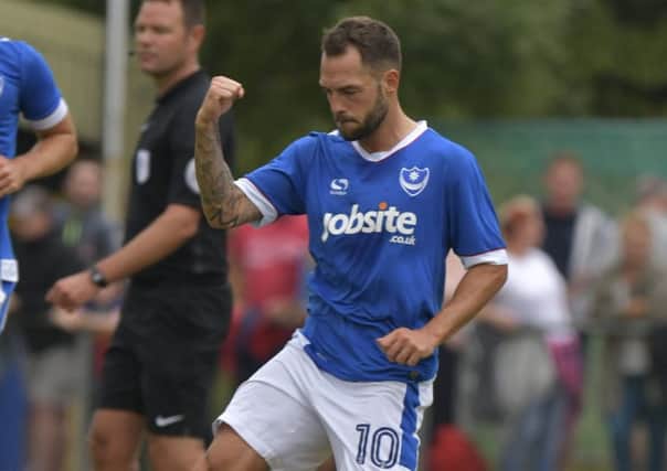 Milan Lalkovic celebrates his goal in Pompey's 8-0 win Picture: Neil Marshall