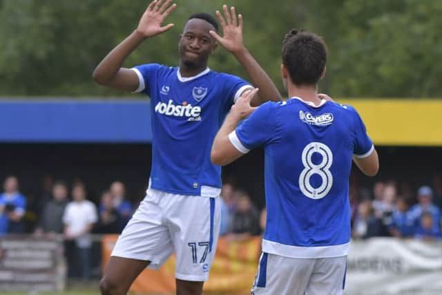 Nicke Kabamba celebrates scoring in Pompey's pre-season friendly win against Newport IW with Ben Close Picture: Neil Marshall
