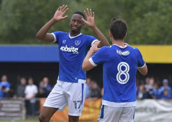 Nicke Kabamba celebrates scoring in Pompey's pre-season friendly win against Newport IW with Ben Close Picture: Neil Marshall