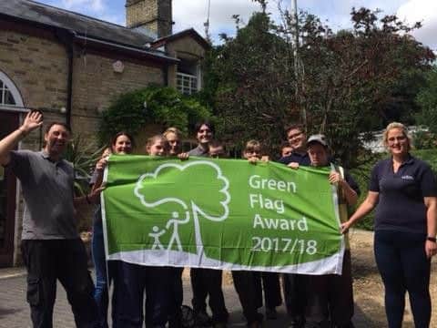 Staff at Staunton Country Park celebrate winning a Green Flag award.