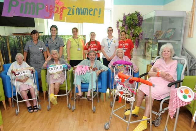 Hospital staff at Queen Alexandra Hospital in Cosham, were helping patients on the Dementia ward decorate their walking frames.Pictured is: (back l-r) Sarah Smith, Chloe Russell, Kerry Budd, Poppy Young, Sarah Pomfret and Evelyn Donoghue with patients (front l-r) Joan Tuck, Doris Bealing, Ronald Rowntree, Doris Long OBE and Joan Horne. Picture: Sarah Standing (170879-4934)