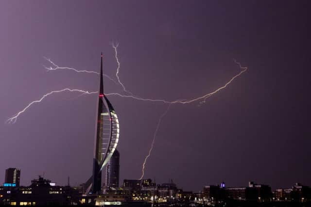 Lightning flashes near the Spinnaker Tower in Portsmouth Picture: Steve Parsons/PA Wire
