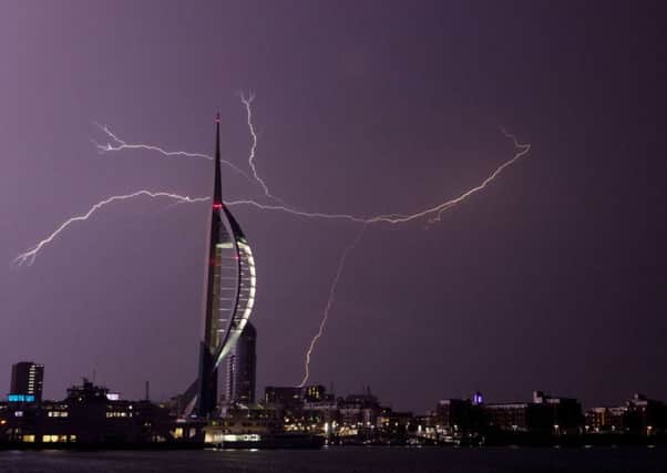 Lightning flashes near the Spinnaker Tower in Portsmouth Picture: Steve Parsons/PA Wire