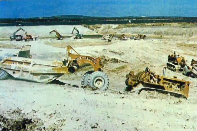 jpns-22-07-17 retro July 2017
Hayling marina - Giant earth-movers in action at the building site of the Northney Yacht Marina, Hayling Island