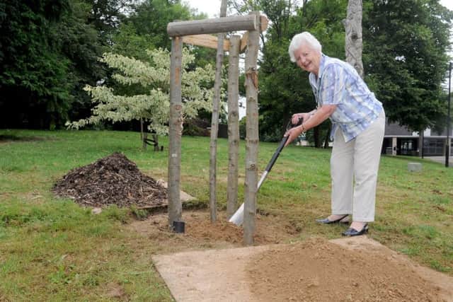 Councillor Gwen Blackett alongside the tree planted in her name.Picture: Sarah Standing
