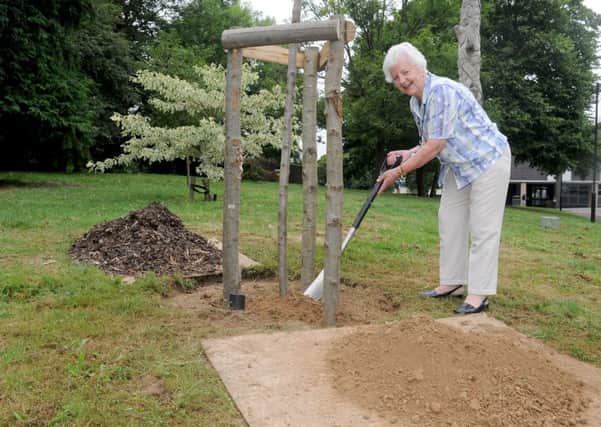 Councillor Gwen Blackett alongside the tree planted in her name.

Picture: Sarah Standing