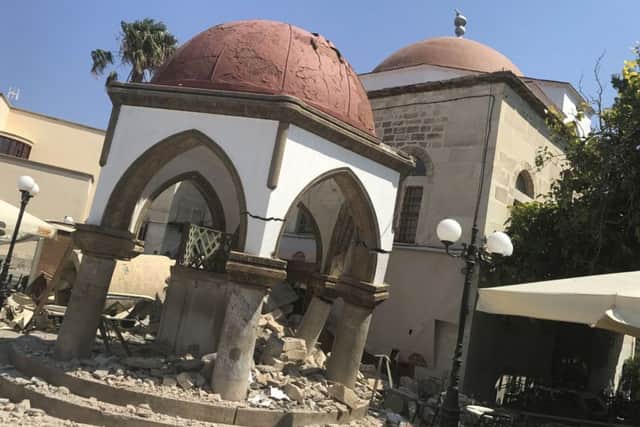 Debris of the collapsed minaret sits around a mosque after an earthquake in Kos on the island of Kos