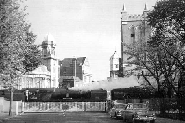 Here we see the Congregational Church from across the  dockyard branch level crossing and see the  steeple has been removed.