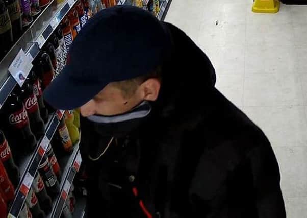 A man spotted on CCTV at robbery at Co-op in Twyford Avenue, Stamshaw on Saturday, July 22. Picture: Hampshire police