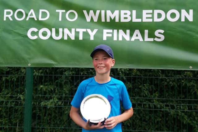 Aaron Butcher with his Road To Wimbledon trophy following coutny glory