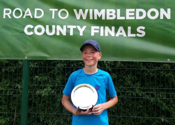 Aaron Butcher with his Road To Wimbledon trophy following coutny glory