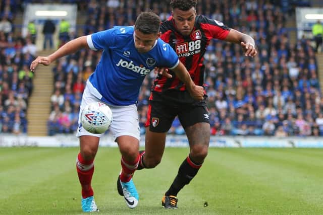 Gareth Evans is put under pressure during today's game at Fratton Park Picture: Shaun Boggust