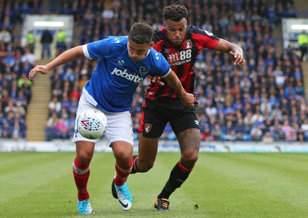 Gareth Evans is put under pressure during today's game at Fratton Park Picture: Shaun Boggust