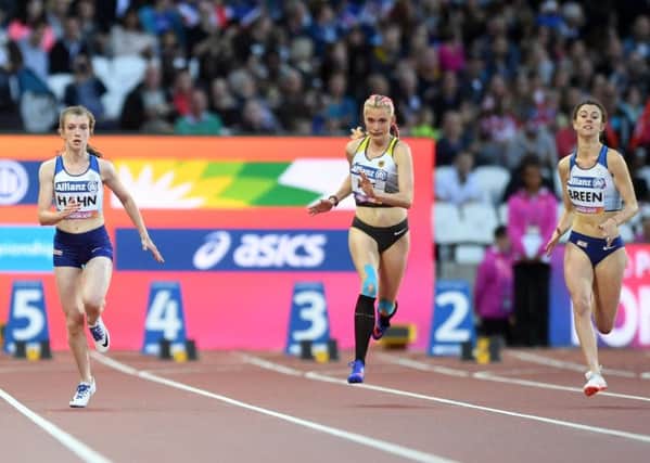 Olivia Breen, right, competing with Sophie Hahn, left, and Germany's Lindy Ave in the Women's 100m T38 final in London