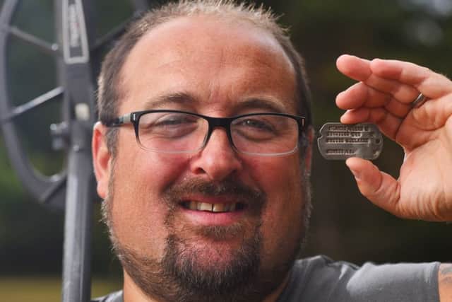Detectorist Chris Belcher-Banes with the dog tag lost over 70 years ago during World War II that he found buried in a field Picture: Solent News & Photo Agency
UK