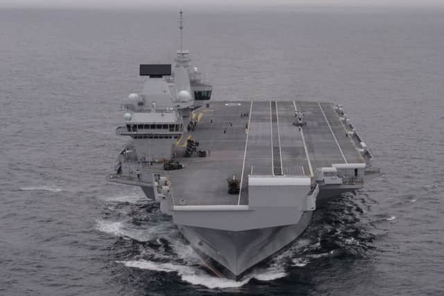 HMS Queen Elizabeth, the Royal Navy's new aircraft carrier, sets sail from Lossiemouth for the latest in a series of sea trials on  Monday July 24. Picture: Stefan Rousseau/PA Wire