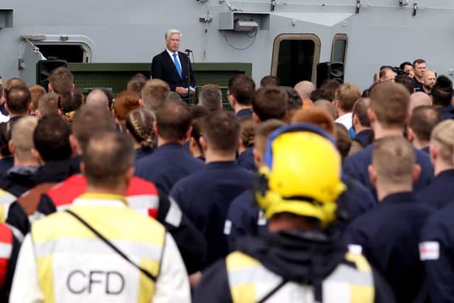Defence secretary Sir Michael Fallon speaking on board HMS Queen Elizabeth as the Royal Navy's new aircraft carrier sets sail from Lossiemouth for the latest in a series of sea trials on Monday, July 24. Picture: PO PHOT Ray Jones/MoD/PA Wire