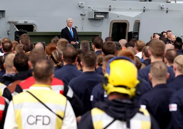 Defence secretary Sir Michael Fallon speaking on board HMS Queen Elizabeth as the Royal Navy's new aircraft carrier sets sail from Lossiemouth for the latest in a series of sea trials on Monday, July 24. Picture: PO PHOT Ray Jones/MoD/PA Wire
