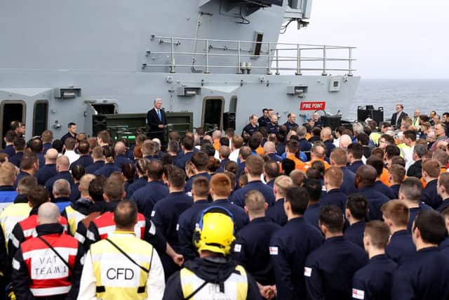 Defence secretary Sir Michael Fallon speaking on board HMS Quefen Elizabeth as the Royal Navy's new aircraft carrier sets sail from Lossiemouth for the latest in a series of sea trialson Monday July 24. Picture: PO PHOT Ray Jones/MoD/PA Wire