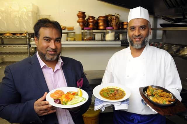 From left, Ru Karim and Lahin Karim at the Gandhi Restaurant in Kingston Road, Portsmouth, which won The News Curry House of the Year competition Picture:  Malcolm Wells (170726-6279)