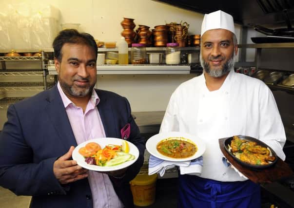 From left, Ru Karim and Lahin Karim at the Gandhi Restaurant in Kingston Road, Portsmouth, which won The News Curry House of the Year competition Picture:  Malcolm Wells (170726-6279)