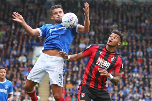 Gareth Evans wins the ball above Bournemouth's Joshua King at Fratton Park. Picture: Shaun Boggust