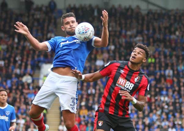 Gareth Evans wins the ball above Bournemouth's Joshua King at Fratton Park. Picture:  Shaun Boggust